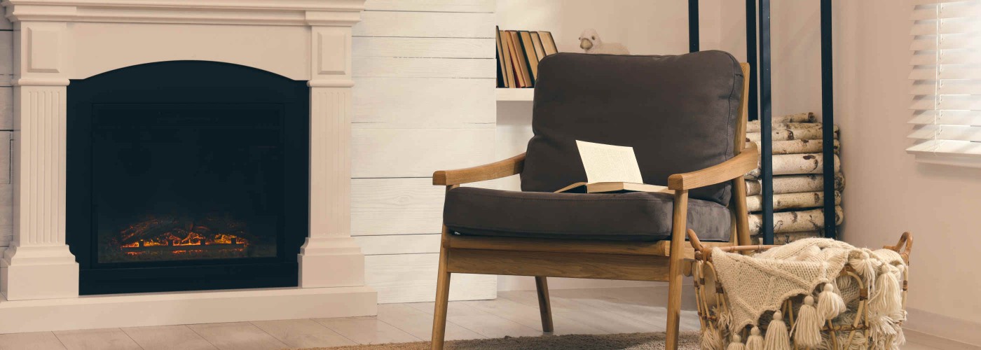 Cozy living room interior with comfortable armchair near fireplace