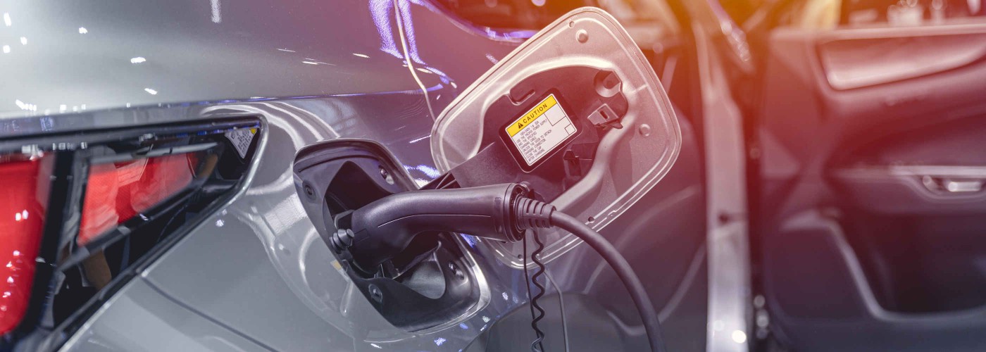 EV Car at charging station, Electric car green energy and eco power concept.
